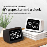 Multifunctional wireless speaker with digital clock on a wooden surface