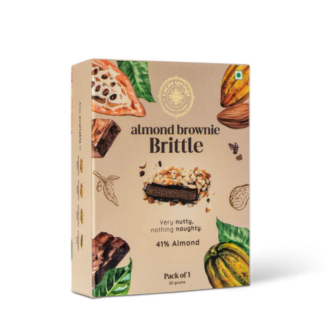 Packaging of Cacao Springs Almond Brownie Brittle with illustrations of a brownie, almonds, and cocoa on the front.