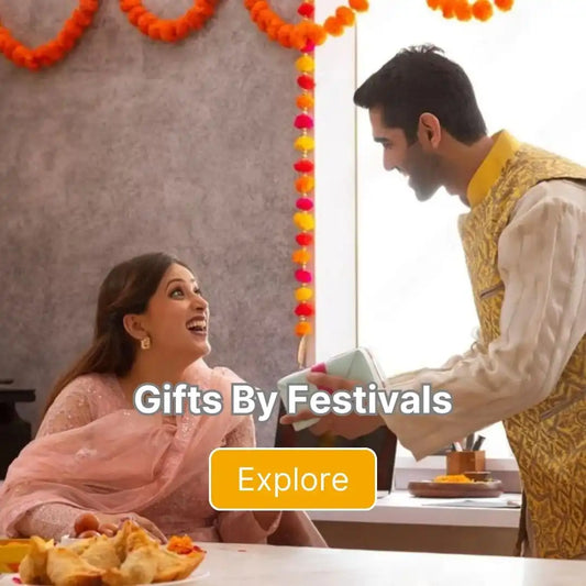 A couple interacting during a festive occasion, with decorations and food visible.