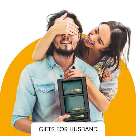 Gift box with three drawers held by a couple, with the woman covering the man’s eyes.