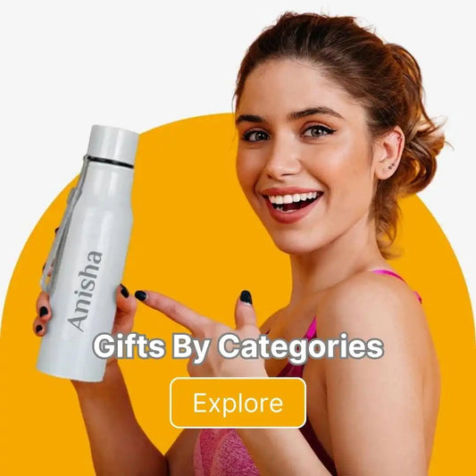 Stainless steel water bottle with ’Anisha’ printed on it.